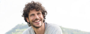 man Smiling Curly Hair